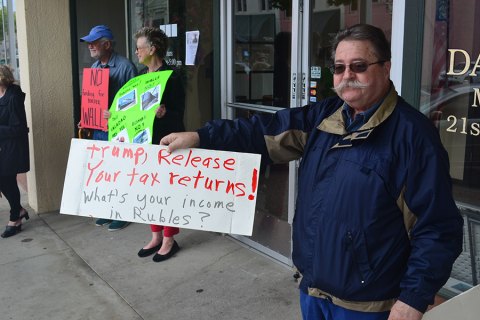 Local Democrats brave wet weather to protest Trump, Valadao downtown Hanford Ron Bates was on hand Tuesday to protest at Congressman David Valadao's office in Hanford.